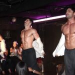 Exciting male dancer on stage at Hunk-O-Mania, NYC. Dynamic performance showcasing the vibrant and entertaining male revue show